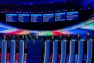 Stage of the UEFA EURO 2024 group draw with the group overview on screen